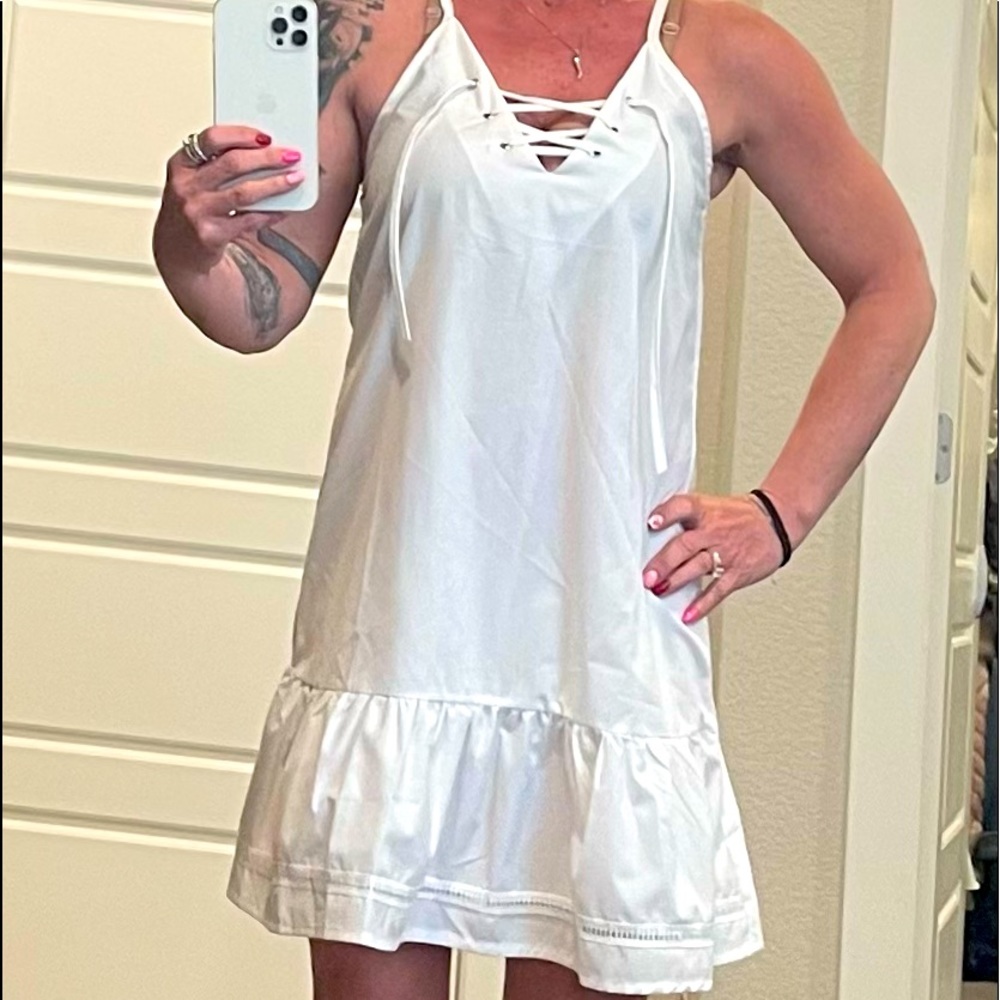 Little white spaghetti strap dress. Purchased it on Facebook. They sent me two